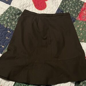 Thigh length black skirt